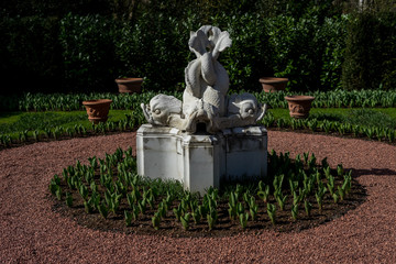 Flower garden, Netherlands , a fire hydrant sitting in the grass