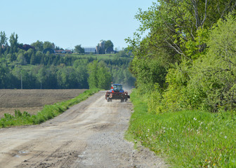 Farm tractor on country road