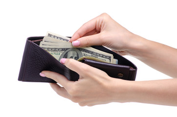 Money dollars in purse in hand on white background isolation