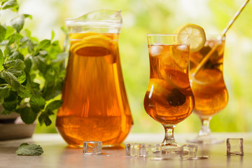 Iced tea with lemon and ice cubes