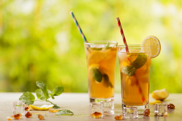 Iced tea with lemon and ice cubes