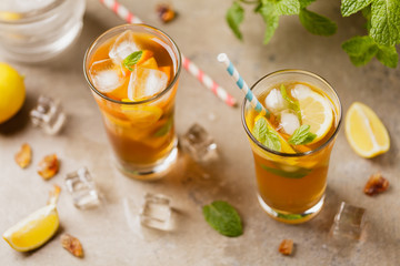 Iced tea with lemon and ice cubes