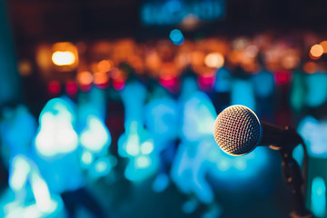 microphone on a stand up comedy stage with colorful bokeh , high contrast image. - obrazy, fototapety, plakaty