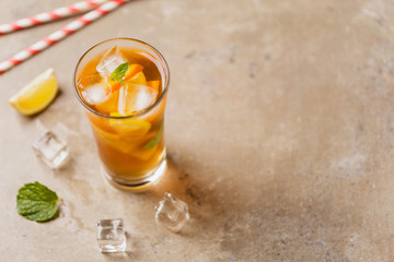 Iced tea with lemon and ice cubes