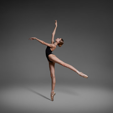 Fototapeta Beautiful flexible ballerina dancing in studio