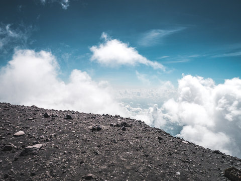 In the mountains on a volcano above the clouds