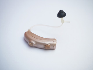 Hearing aid or sound amplifier with isolated on white background, Close up shot photo.