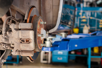 City car in the lifting equipment in the garage being repair and fix, Concept of car fixing.