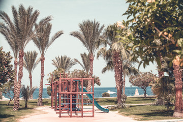 Playground by the beach. Tropical background