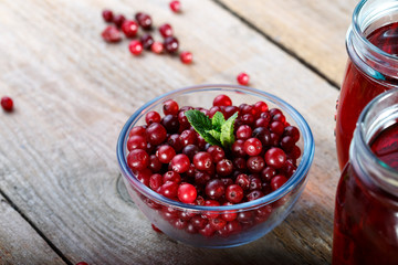 Ripe cranberries in a glass plate.