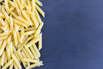 pasta,dry pasta on a dark background with copy space
