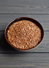 flax seeds in bowl on table background