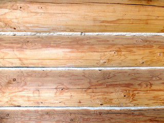 Naklejka premium The texture of the wall of wooden logs