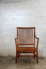 Wattled chair in colonial style, in cement room