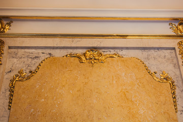 Texture of yellow granite on the wall of a luxury room. golden interior close-up. copy space