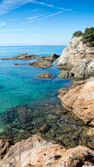 Scenic view of coast of colorful huge cliff and Miditerranien sea near the resort town of Lloret de Mar, Costa Brava Coast, Spain