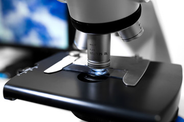 Close up microscope lens on gray background