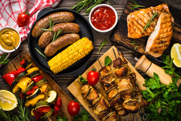 Barbeque dish - Grilled meat, fish, sausages and vegetables.