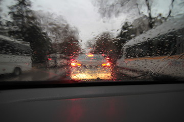 Cars trying to move forward in heavy rain