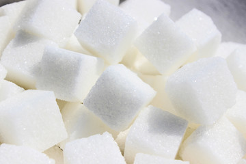Pile of lump sugar or refined close up.