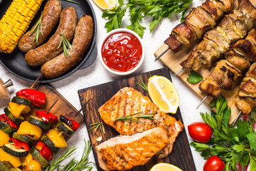Barbeque dish - Grilled meat, fish, sausages and vegetables.