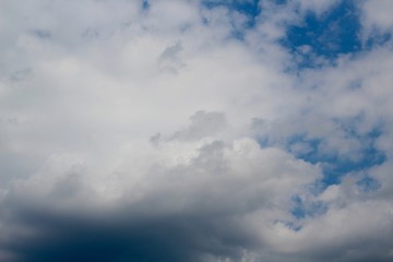 Fototapeta premium The fluffy white clouds in the blue sky.