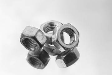 Nuts for bolts close up. Black and white.