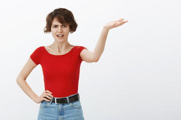 What have you done. Angry bothered pissed woman short haircut raise hand frowning yelling...