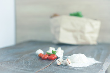Fototapeta na wymiar Healthy eating. Clean fresh vegetables and flour on a wooden table