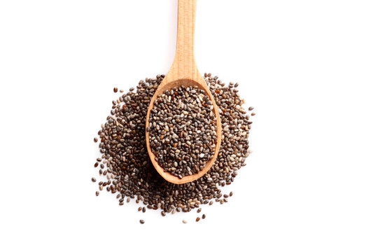 Chia seeds in a wooden spoon isolated on white background