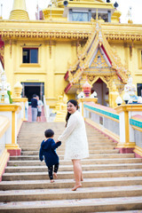 Beautiful Thai women and her son at Thailand temple