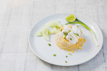 Fried rice with Squid on the wooden table from top view