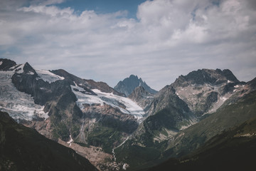 Panorama of mountains scene with dramatic blue sky in national park of Dombay