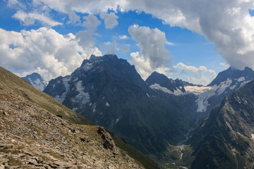 Panorama of mountains scene with dramatic blue sky in national park of Dombay