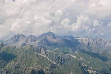 Fototapeta premium Panorama of mountains scene with dramatic cloudy sky in national park of Dombay