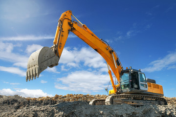 Excavator in a quarry mining clay