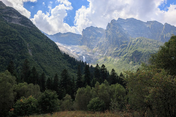 Fototapeta na wymiar Panorama view on mountains scene and away waterfall in national park of Dombay