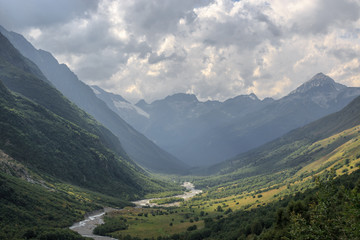 Naklejka premium Panorama view on mountains with river scene in national park of Dombay
