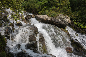 Closeup view waterfall scene in mountains, national park of Dombay, Caucasus