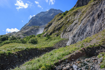 Panorama view of waterfall scene in mountains, national park of Dombay, Caucasus