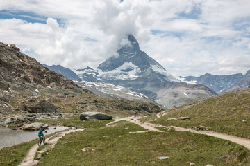 Fototapeta na wymiar Panorama of Riffelsee lake and Matterhorn mountain in national park Zermatt