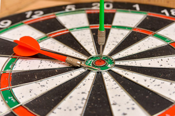 Round board for playing darts close-up, team and single game in the spirit of rivalry.