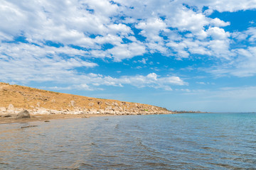 Rocky sea shore empty beach
