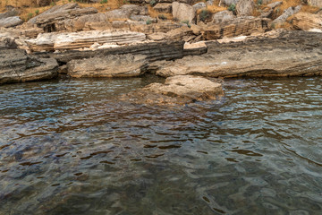 Rocky seashore with azure water