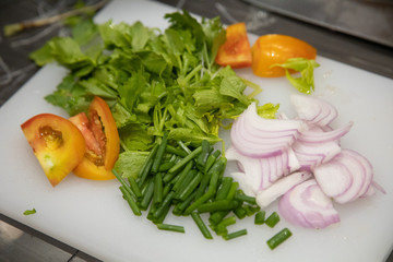 Cooking Workshop with raw food material such as cutting vegetable on Butcher ready for cook.