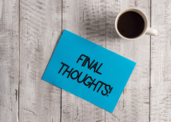 Text sign showing Final Thoughts. Business photo showcasing should be last few sentences within your conclusions Pastel Colour paper placed next to a cup of coffee above the wooden table