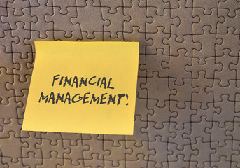 Writing note showing Financial Management. Business concept for efficient and effective way to...