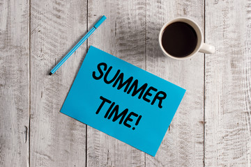Conceptual hand writing showing Summer Time. Concept meaning achieve longer evening daylight summer setting clocks hour ahead Pastel Colour paper and pen with coffee cup on wooden table