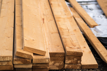 log of timber wood for home use laying down on the ground