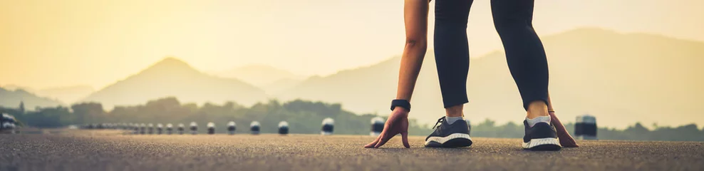 Fotobehang close up of woman leg in running start to reach the goal. Jogging workout and sport healthy lifestyle concept. proportion of the banner for ads. © sitthiphong
